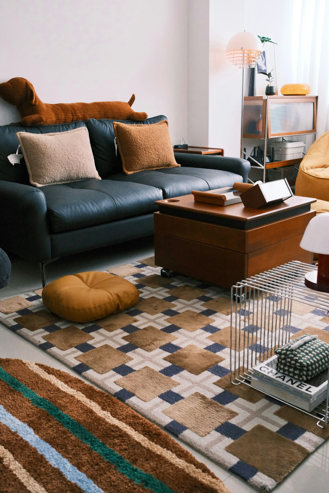 Cozy living room with sofa, coffee table, and patterned rugs